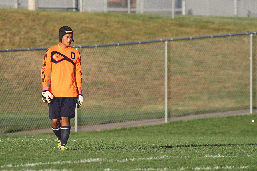 Playing Piper high school on Tuesday, Oct. 7, junior varsity  goalie Parker Billings wears his concussion helmet because he feels that it gives him an additional level of safety during the game.