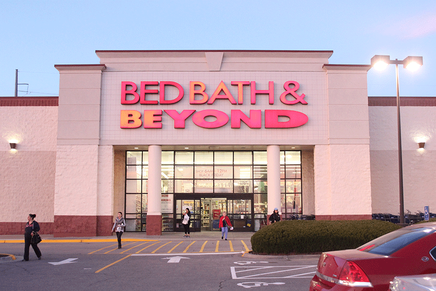 As senior Kate Schau restocks products inside Bed, Bath and Beyond, there is a constant flow of shoppers going in and out of the store on Friday, Nov. 28.