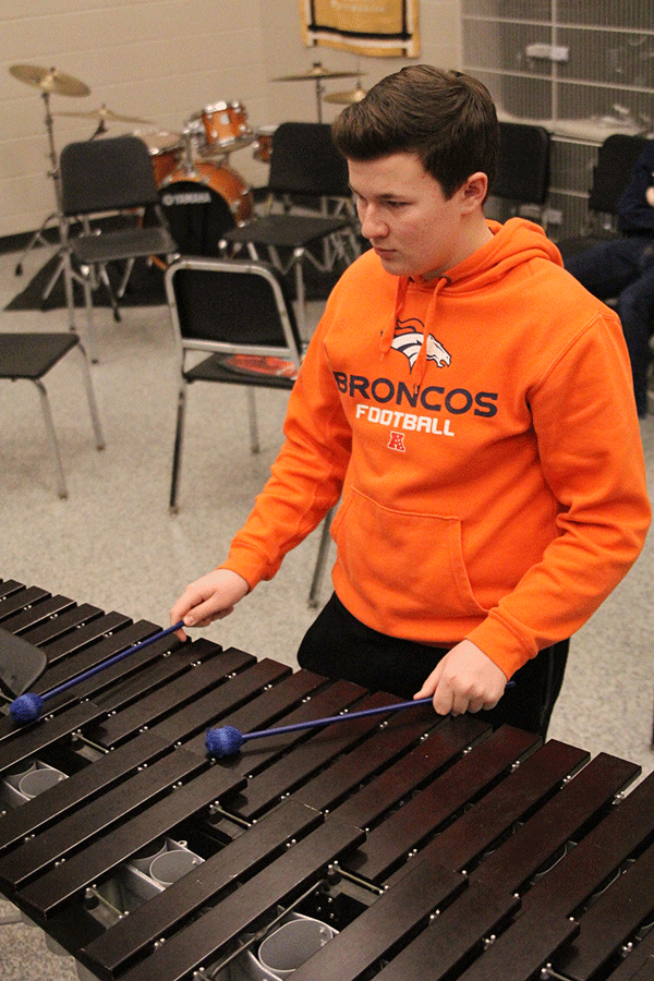 Junior Spencer Hamilton plays the marimba in a rehearsal for Silver Band on Wednesday, March 4. 