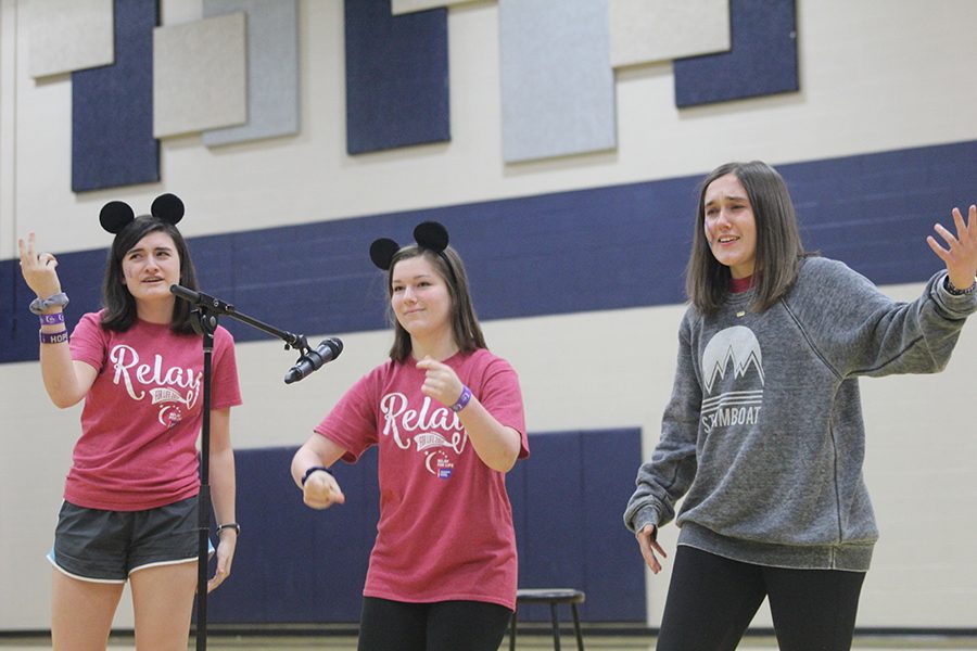 Juniors Abby Hoepner, Annie Myers and Hannah Barnes perform during open mic.