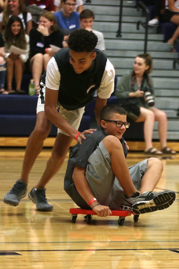 Trying to win a free homecoming ticket, freshman race to finish the relay first. 