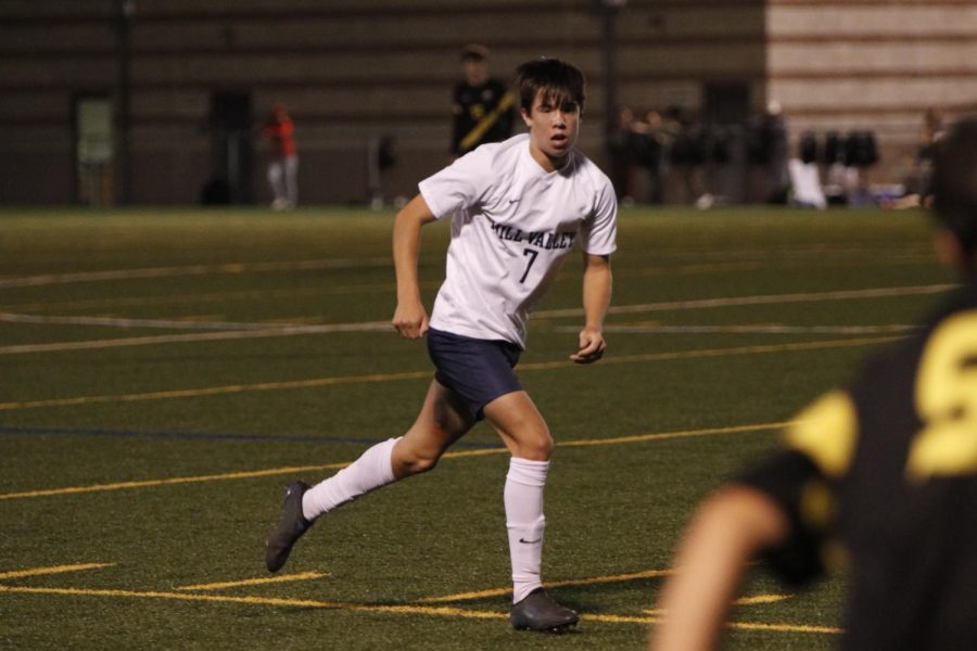 Winning 3-1, senior Cody Geis runs to the ball against Shawnee Mission West. 