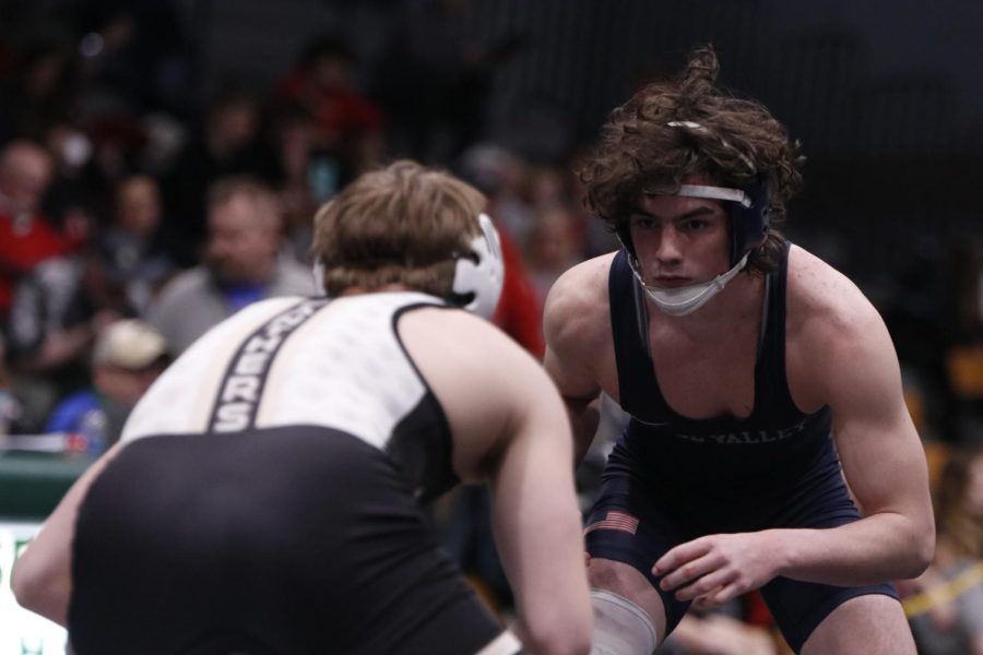 Staring into his opponents eyes, junior Maddox Casella wins his match 2 to 1 at Basehor-Linwood High School.