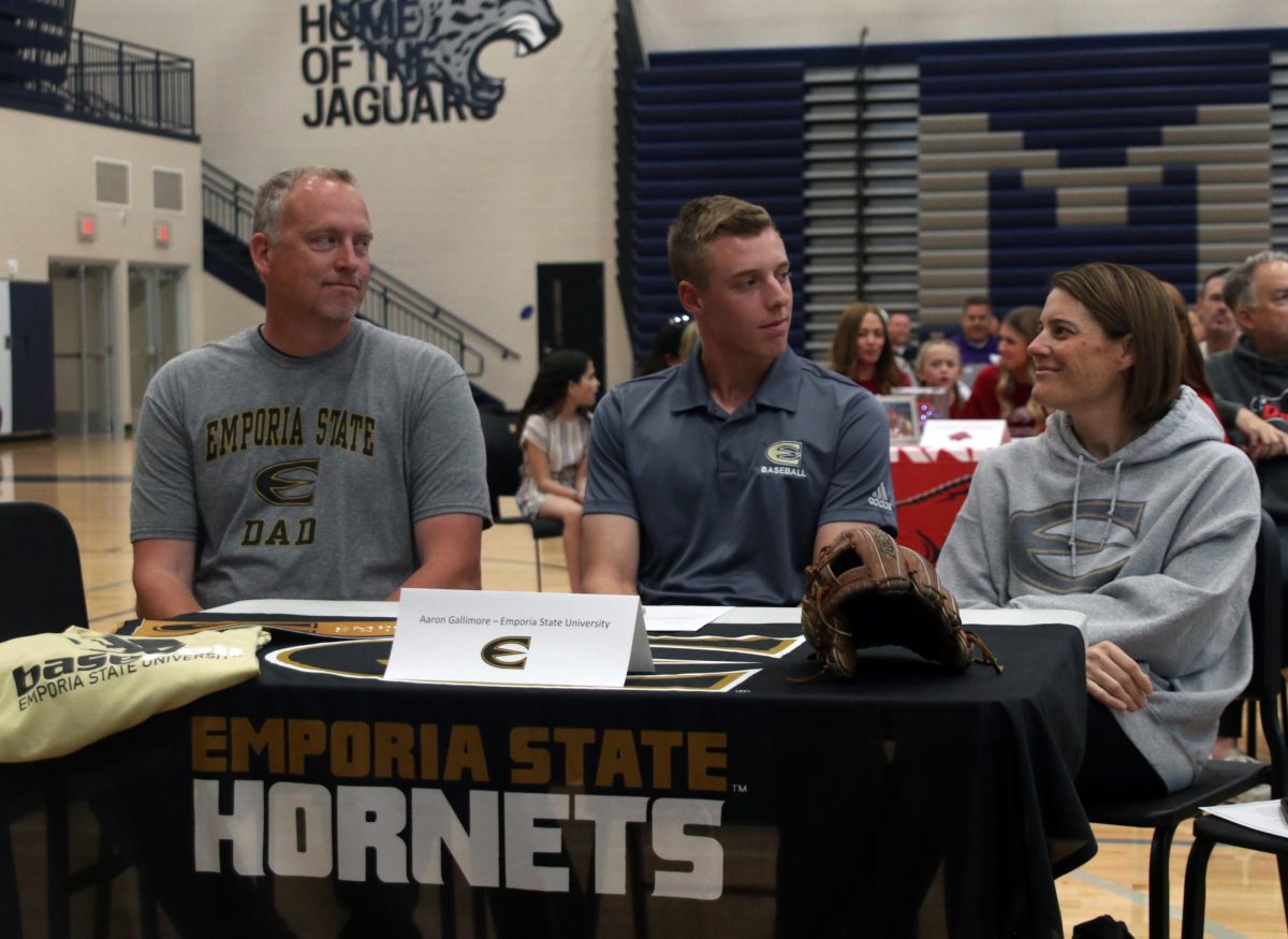 Looking at his parents, signee senior Aaron Gallimore smiles before the signing ceremony begins. Gallimore plans to attend Emporia State University for baseball. 