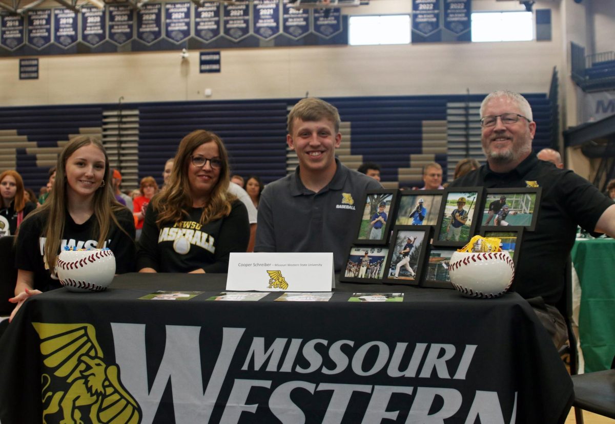 Senior Cooper Schreiber smiles before signing for Missouri Western State University baseball. 