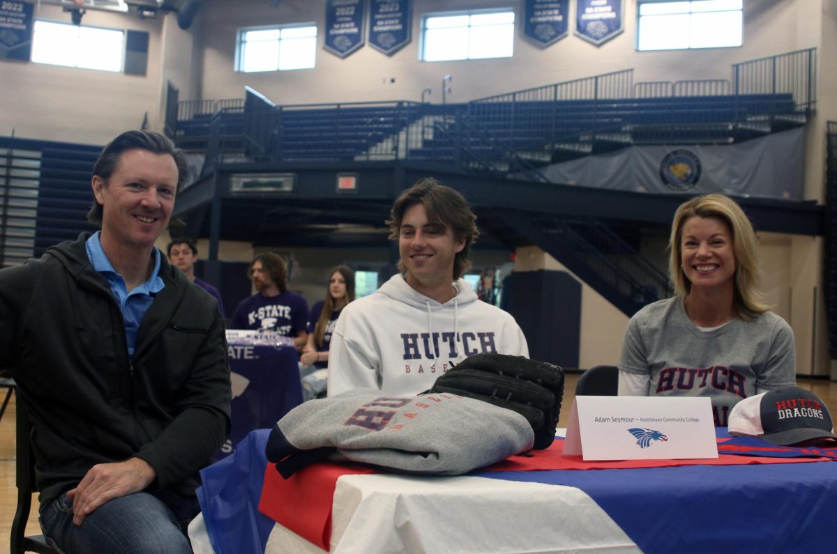 Signee senior Adam Seymour smiles as he prepares to continue his baseball career at Hutchinson Community College. 