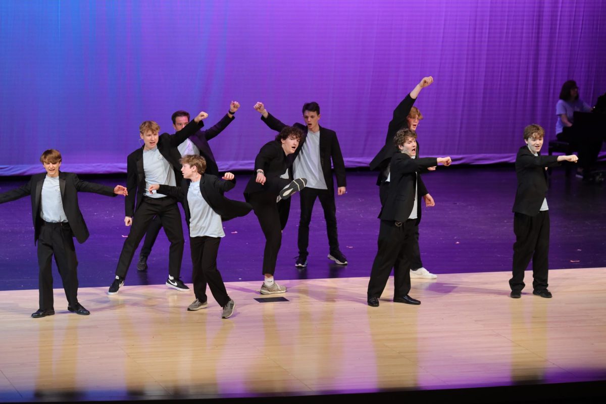 With their fists in the air, Jag Singers tenor basses sing “Trebles Finals” from the movie “Pitch Perfect”. 