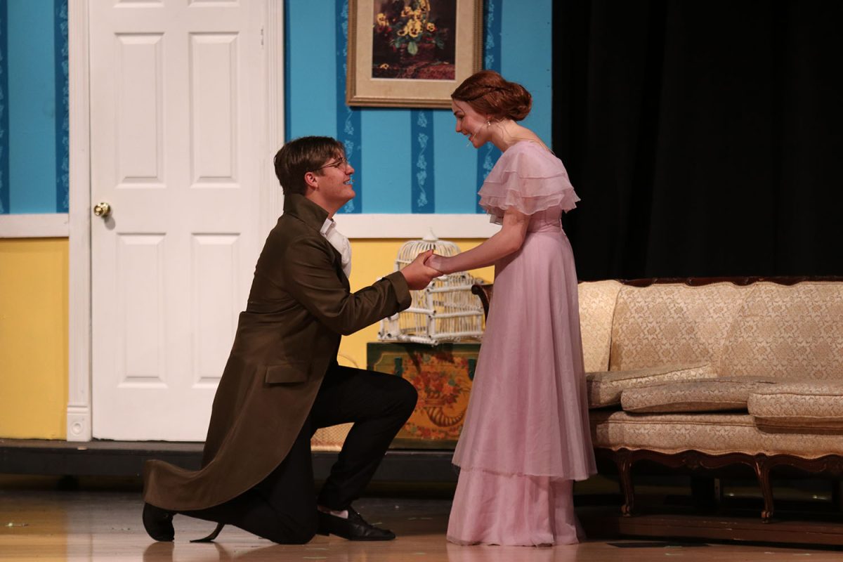 Down on one knee, Mr. Bingley, played by junior Blake Powers, proposes to Jane Bennett during the pride and prejudice play April 2023.  