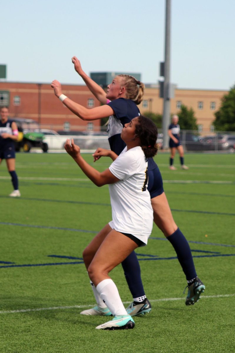 Reaching her head up, senior Brooke Bellehumeur prepares to head-but the ball