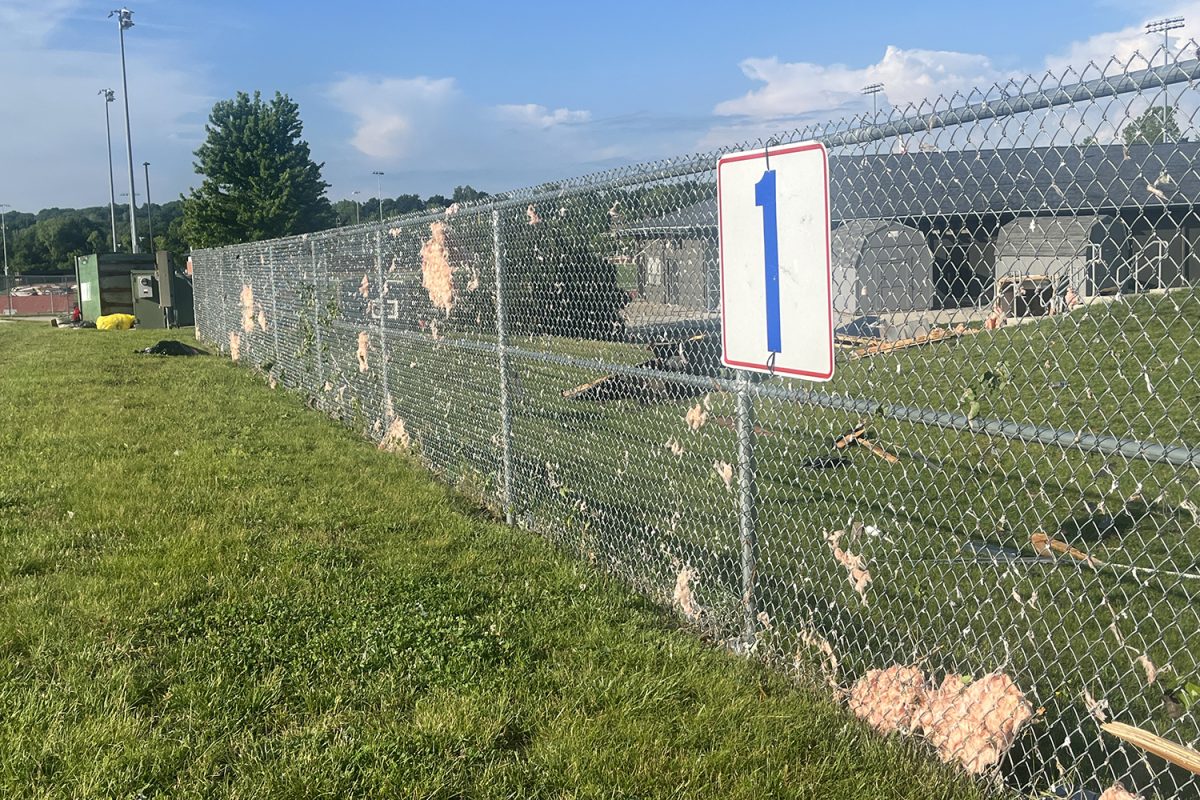 Insulation from the football ticket booths was smashed against the soccer field fence.