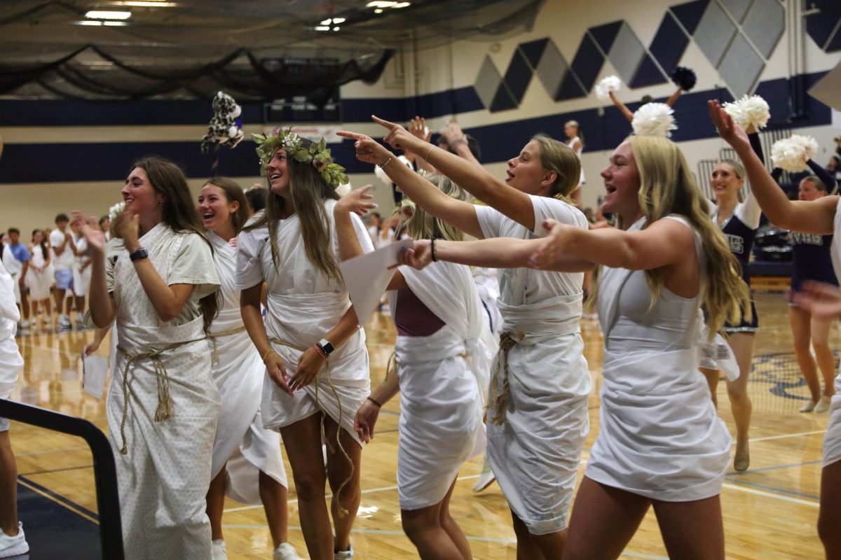 Members of Stuco and JLC lead the fight song and get the freshmen on their feet during the pep assembly.