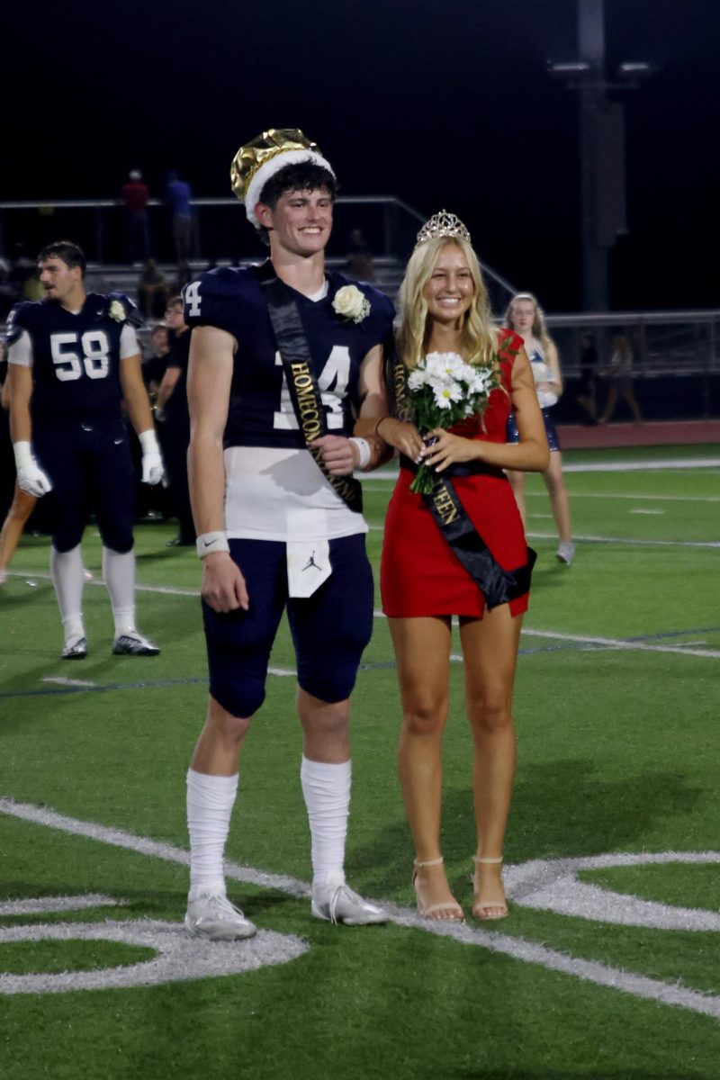 Standing together, seniors Connor Bohon and Maggie Wieland get crowned as Homecoming King and Queen.
