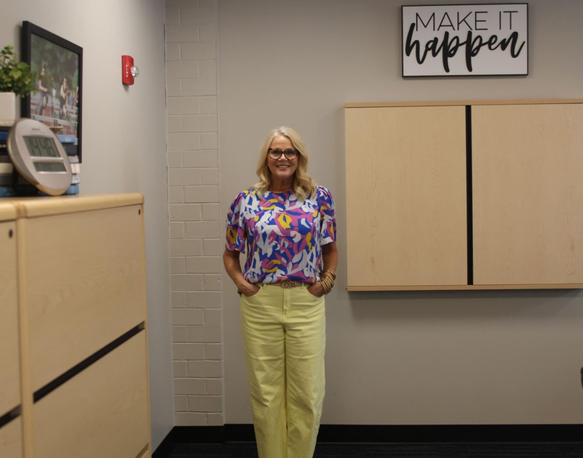 Principal Dr. Gail Holder poses in her office.