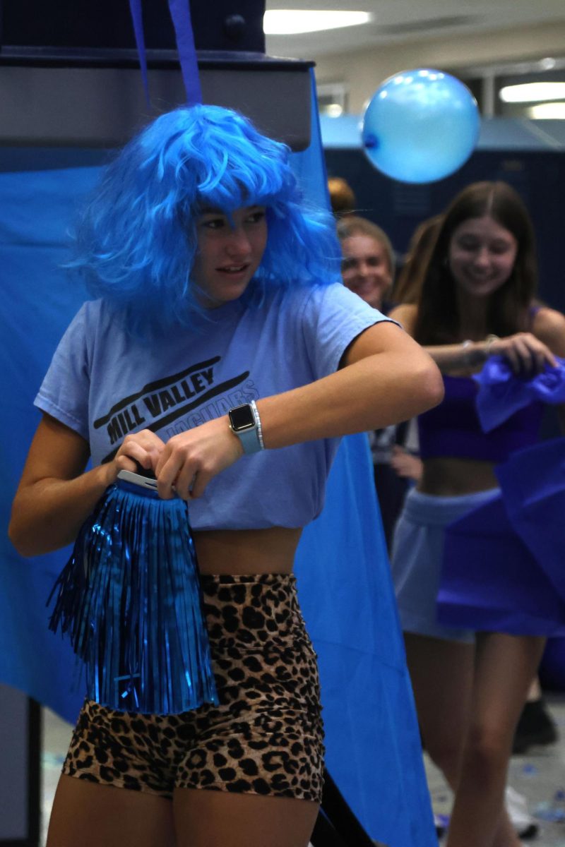 Focused, senior Arye Meyer prepares to hang up decorations.
