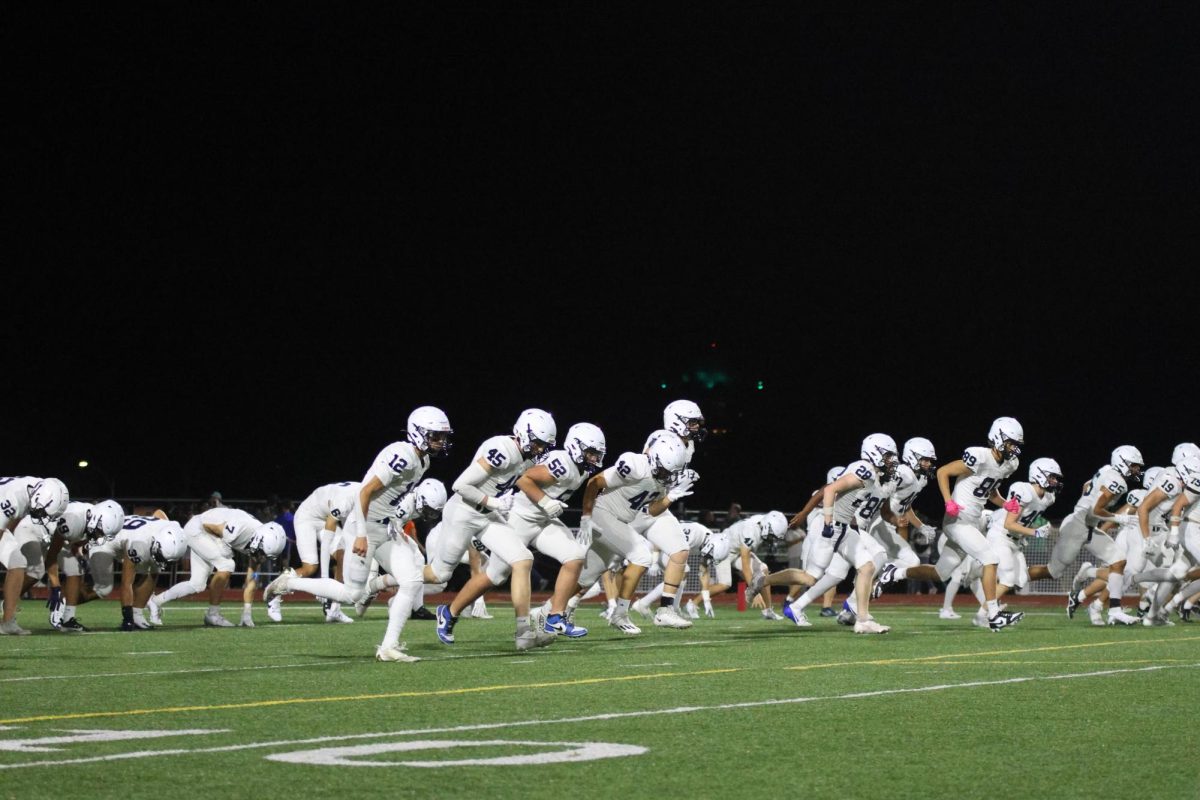 After halftime, Mill Valley warms up on the field.