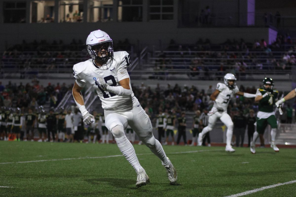 Junior Blake Jay runs from his opponent.