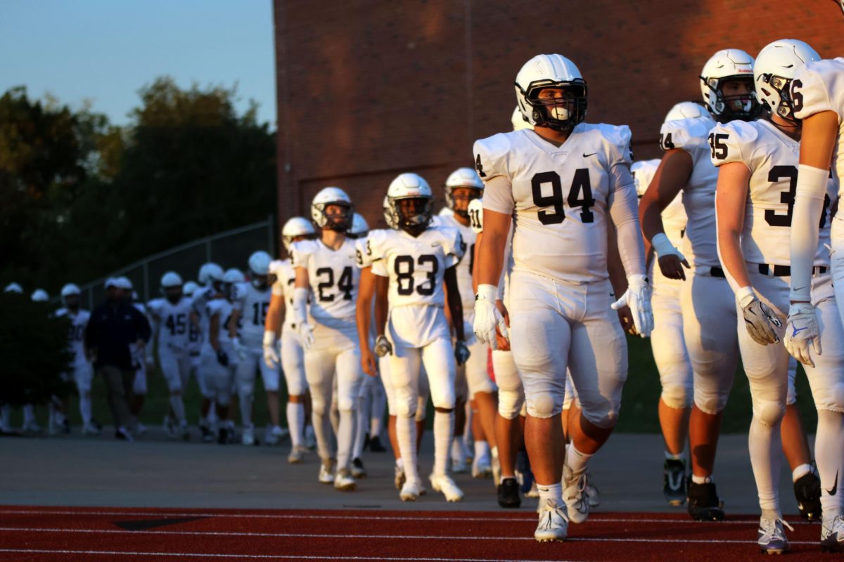 Game face on, Junior Hayden Heller walks on to the field.