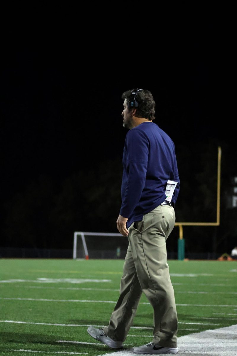 Coach Strack heads onto the field.