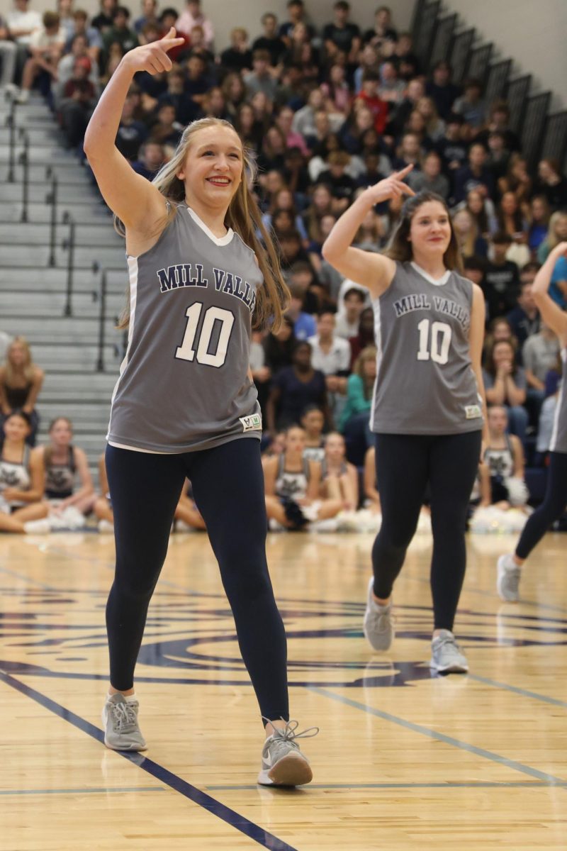 With a smile on her face, senior Ashley Ayers performs a routine with the Silver Stars.