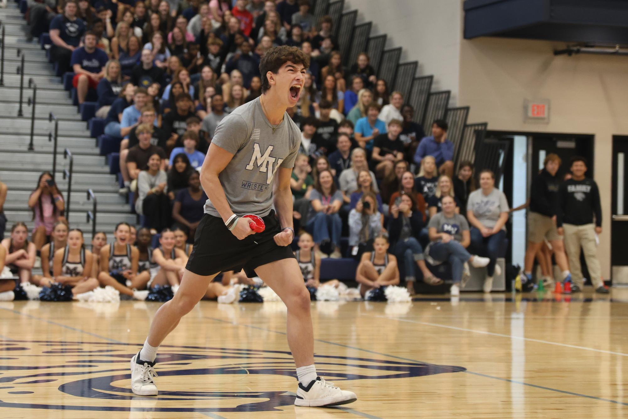 Yelling toward the seniors, senior Noah Pham celebrates after winning the class game.