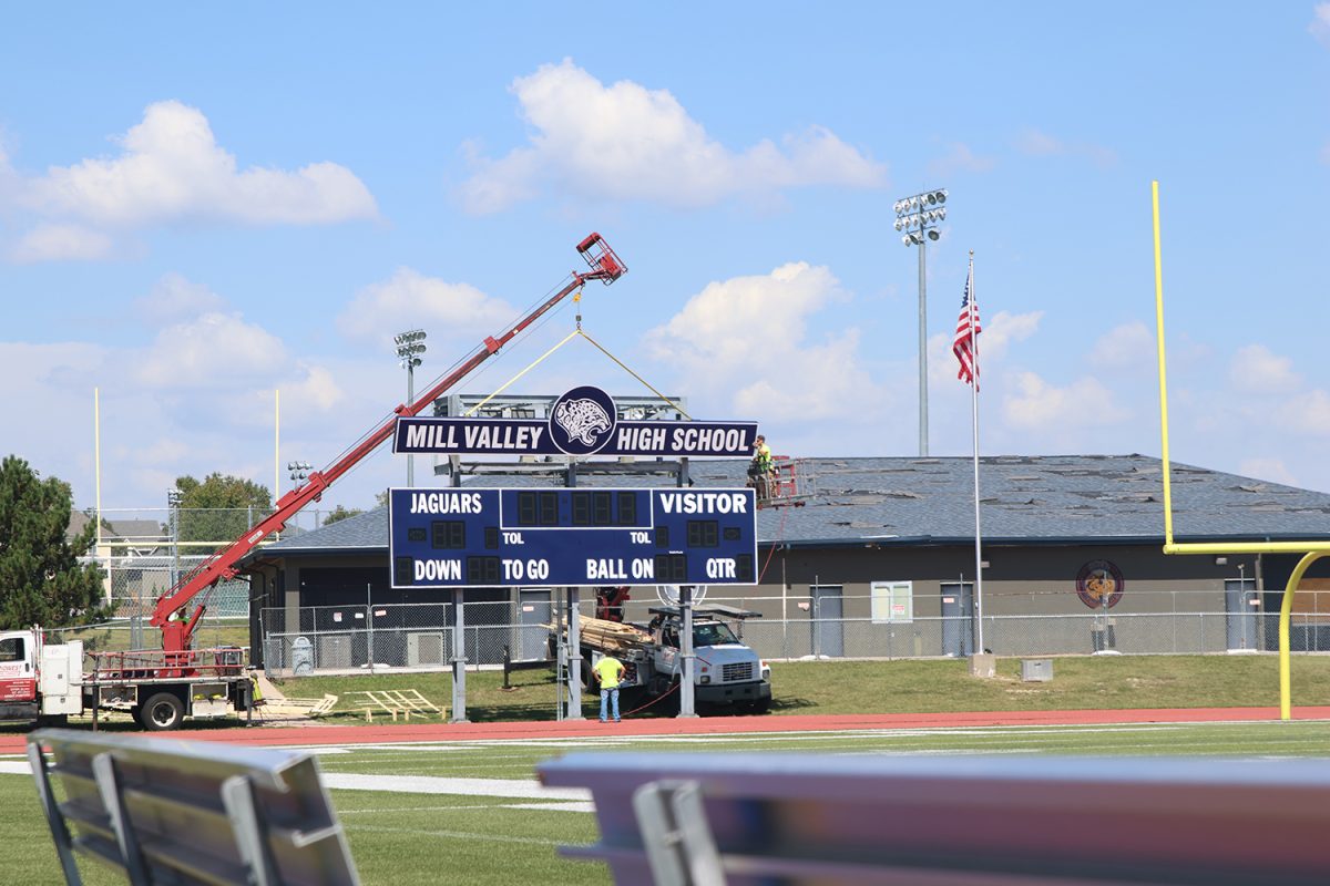 Construction crews lifting a piece of the new scoreboard on September 5