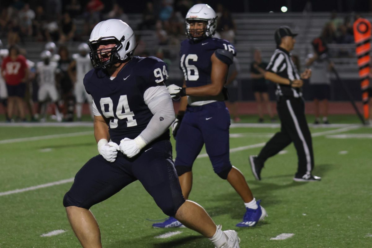 In celebration, junior Hayden Heller screams towards his team.
