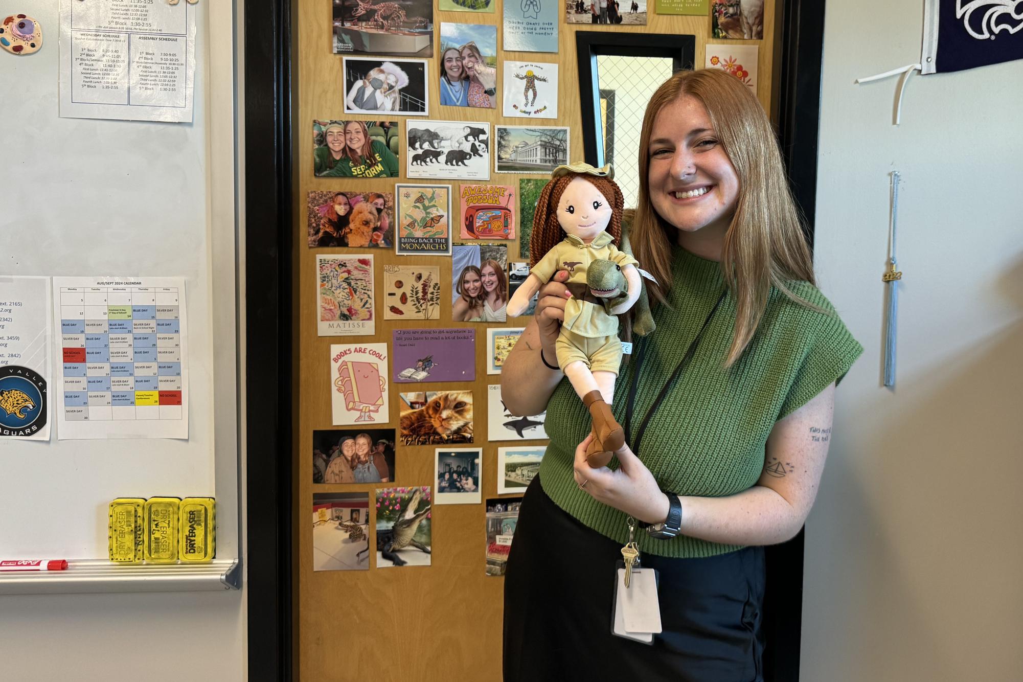 Science teacher Carolline Gambill poses with her paleontologist look-a-like doll she got at the American Museum of Natural History.  