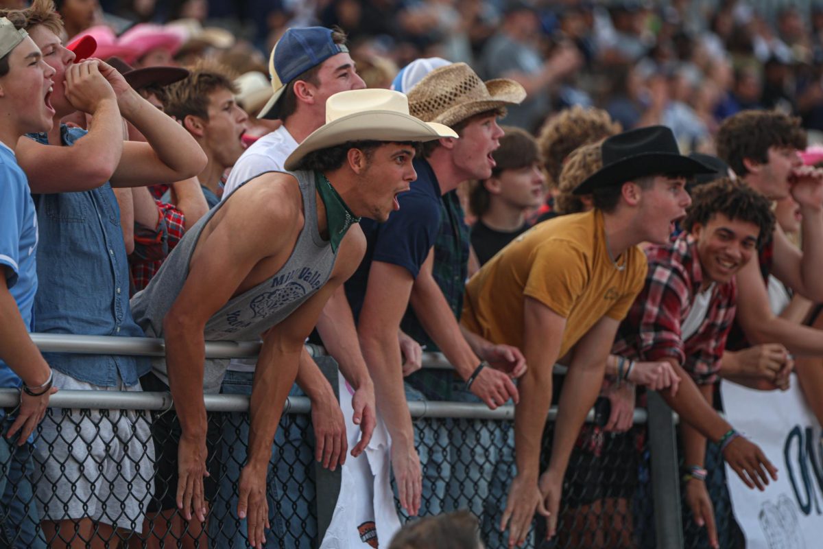 During kickoff, senior Jake Hobbs screams along with the student section.