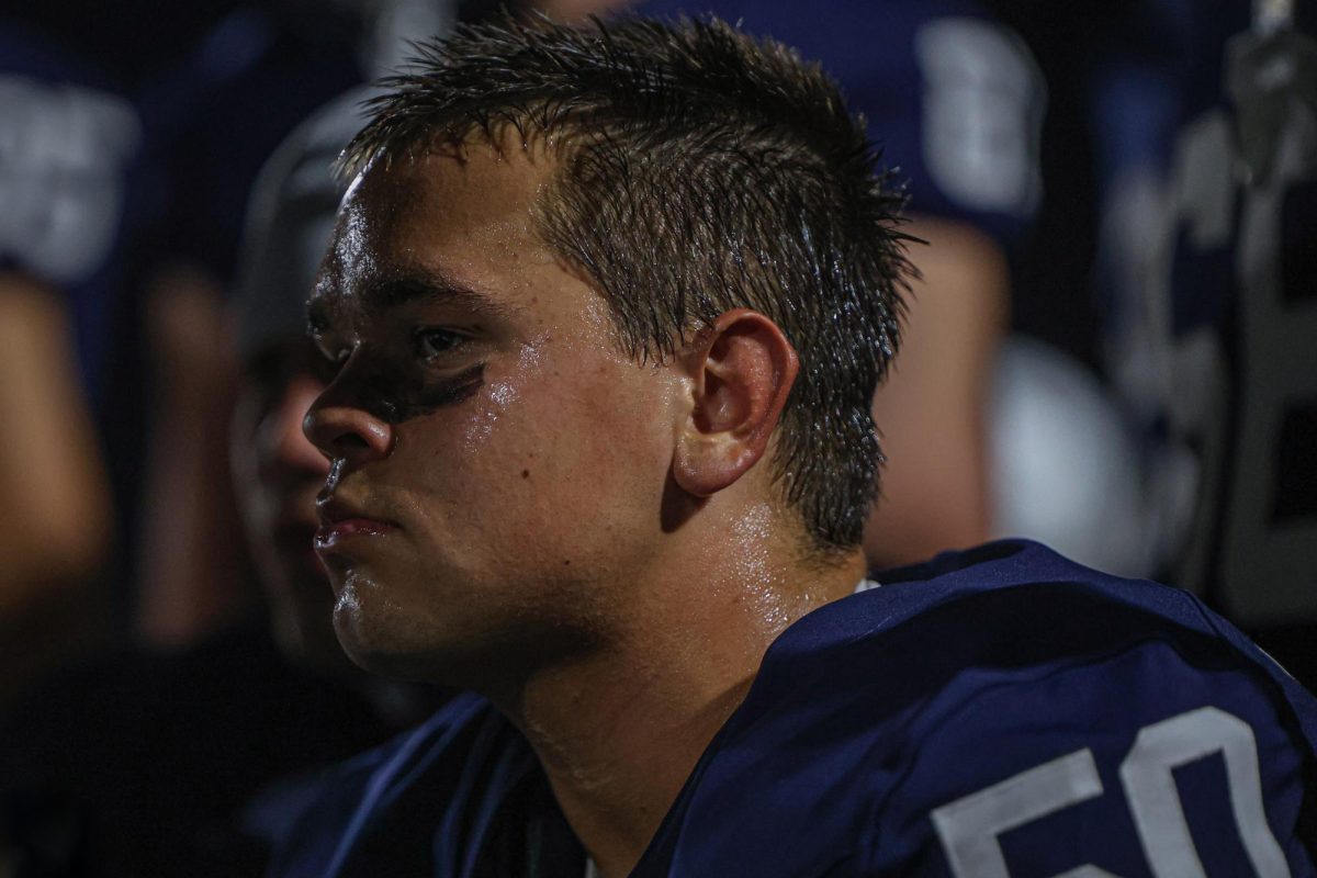 After an offensive drive, senior Zach Zaldivar listens to his coach.