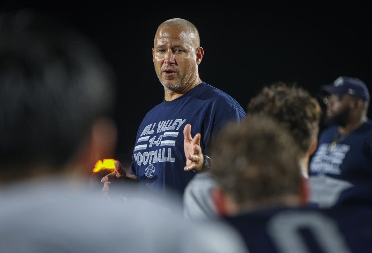 After the scrimmage, head coach Joel Applebee motivates his players to stay focused on the upcoming week.