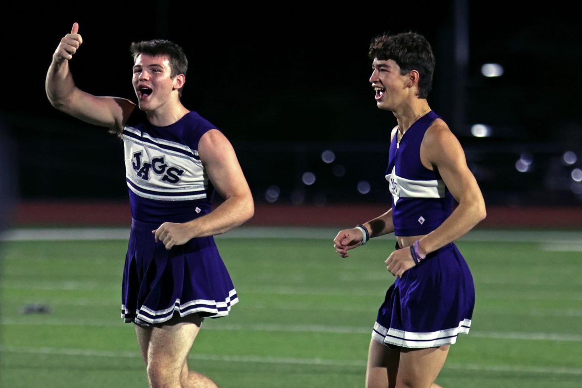 Seniors Alex Lorhan and Noah Pham run on the field after the senior team scored. 