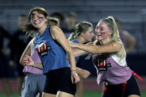 Laughing, junior Callaway Clifton pushes her opponent, senior Kennedy Goertz. 