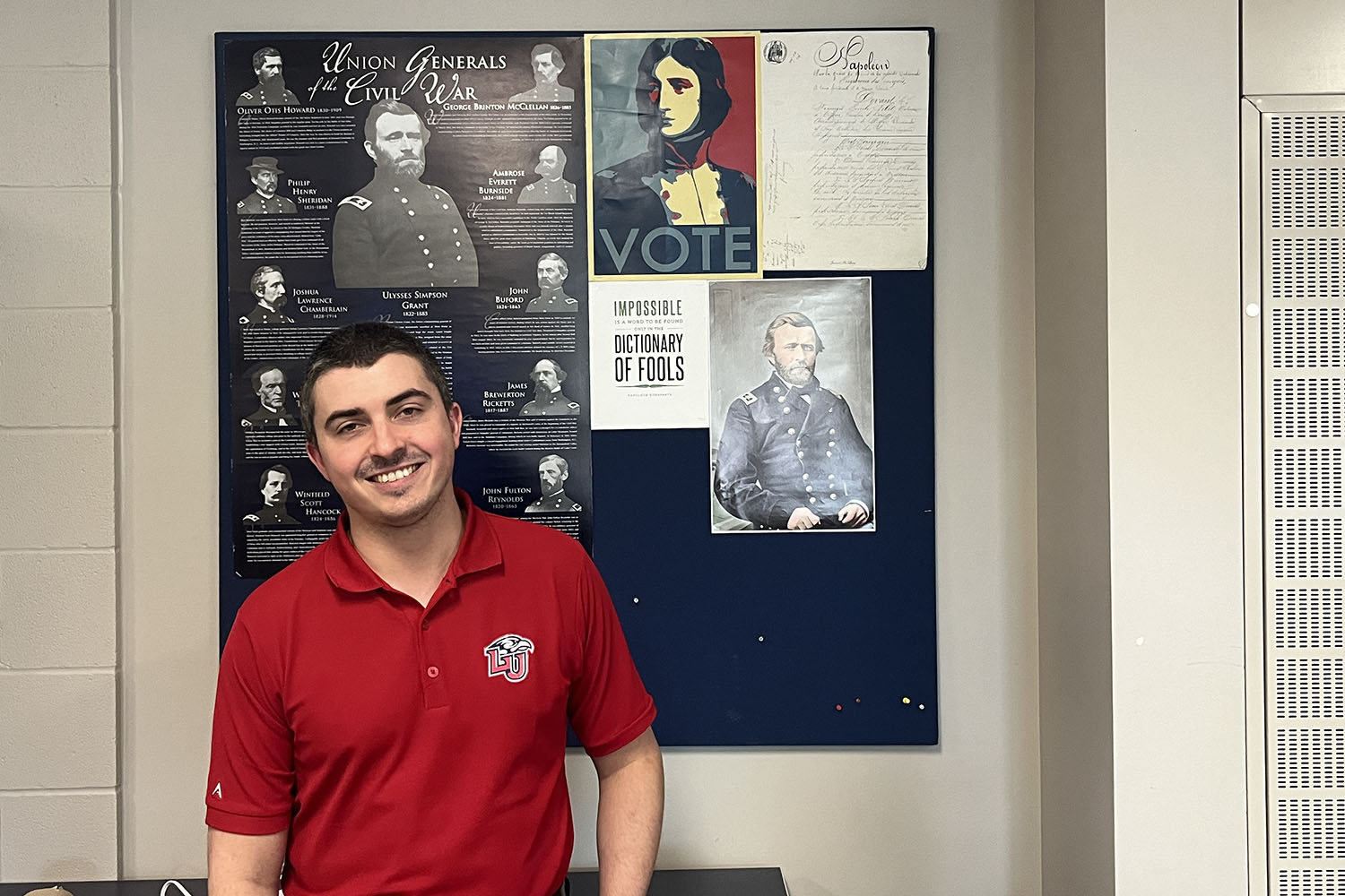 Dr. Nathan Provost poses with a French poster of Napoleon, mocking Barack Obama's "Hope" campaign.