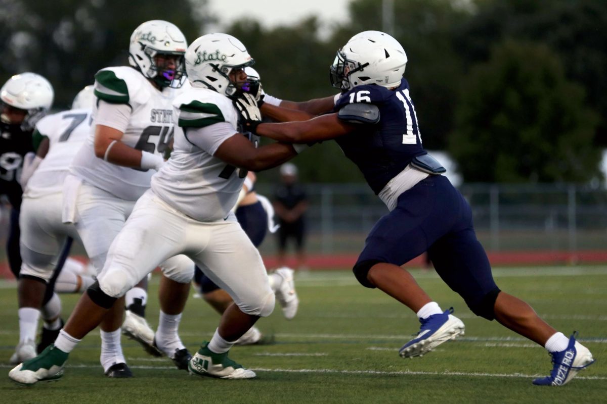 Sophomore Larry Jones blocks the opposing team.