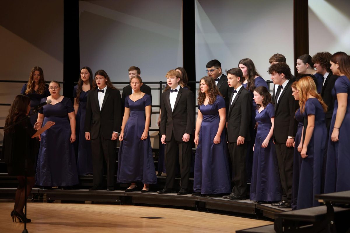 In unison, the Jag Singers perform “Flower of Beauty”.