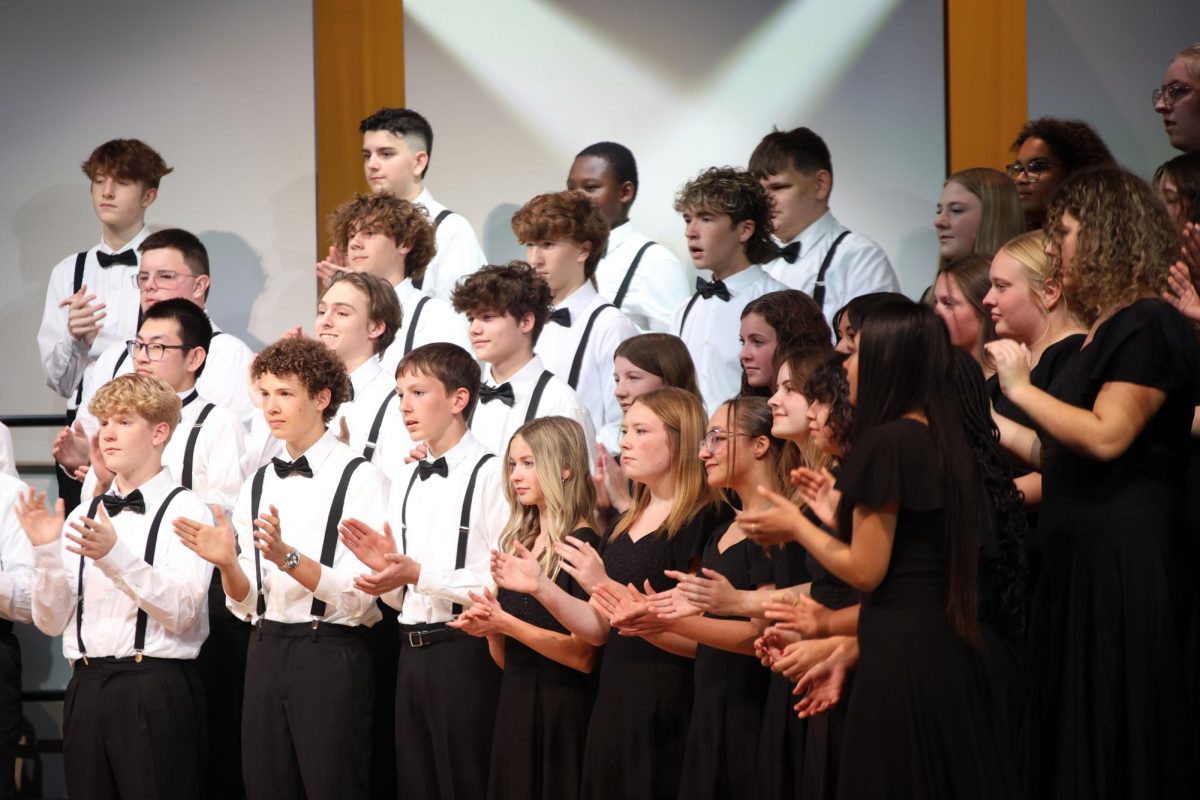 While performing “Mairi’s Wedding”, Concert Choir claps in time with the music.