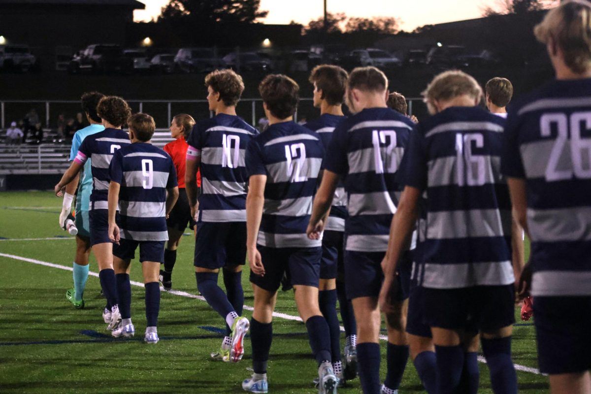 Starters walk out onto the field to start game against Lawrence Free State on Thursday, Sept. 26.