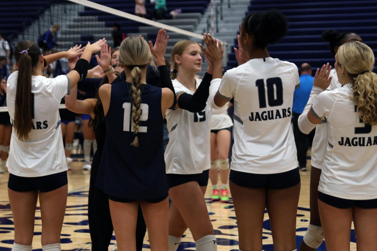 Team congratulates each other after a win.