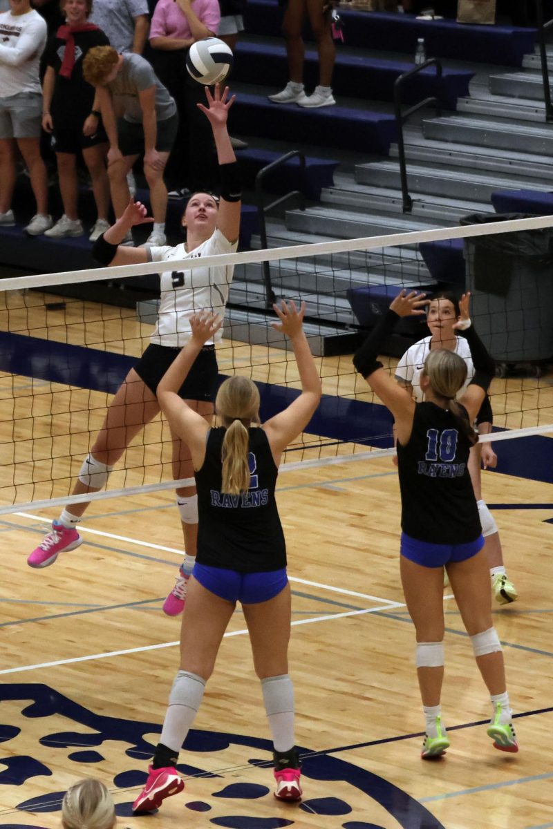 Focused on the ball, senior Saida Jacobs prepares to spike. 