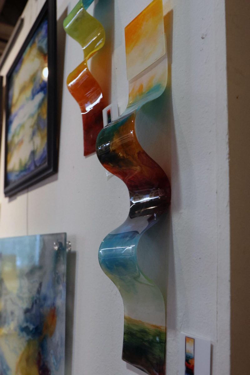 Plexiglass sculptures by Jackie Warren are displayed in her area of the studio. 