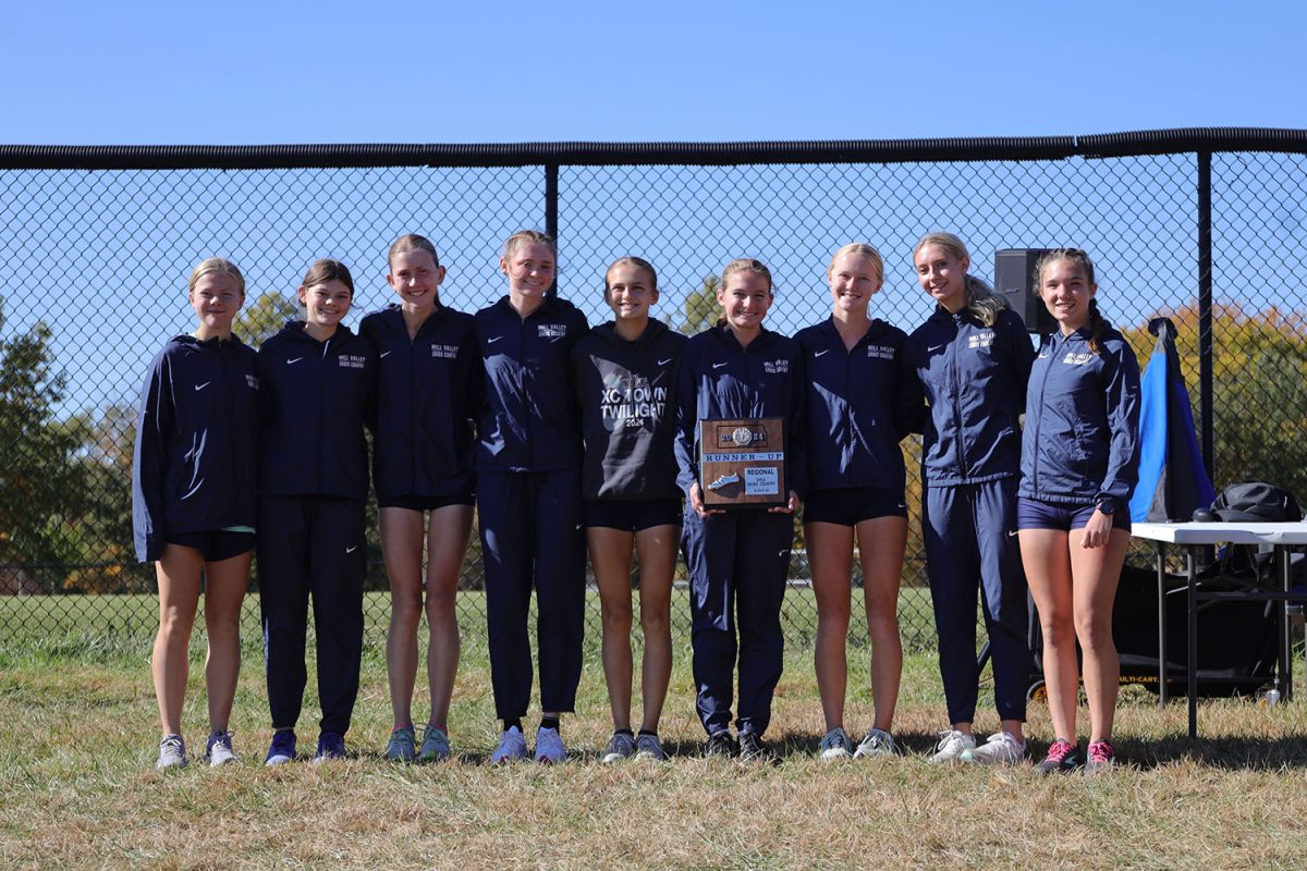 The girls' team poses for a picture with their regional runner-up plaque.