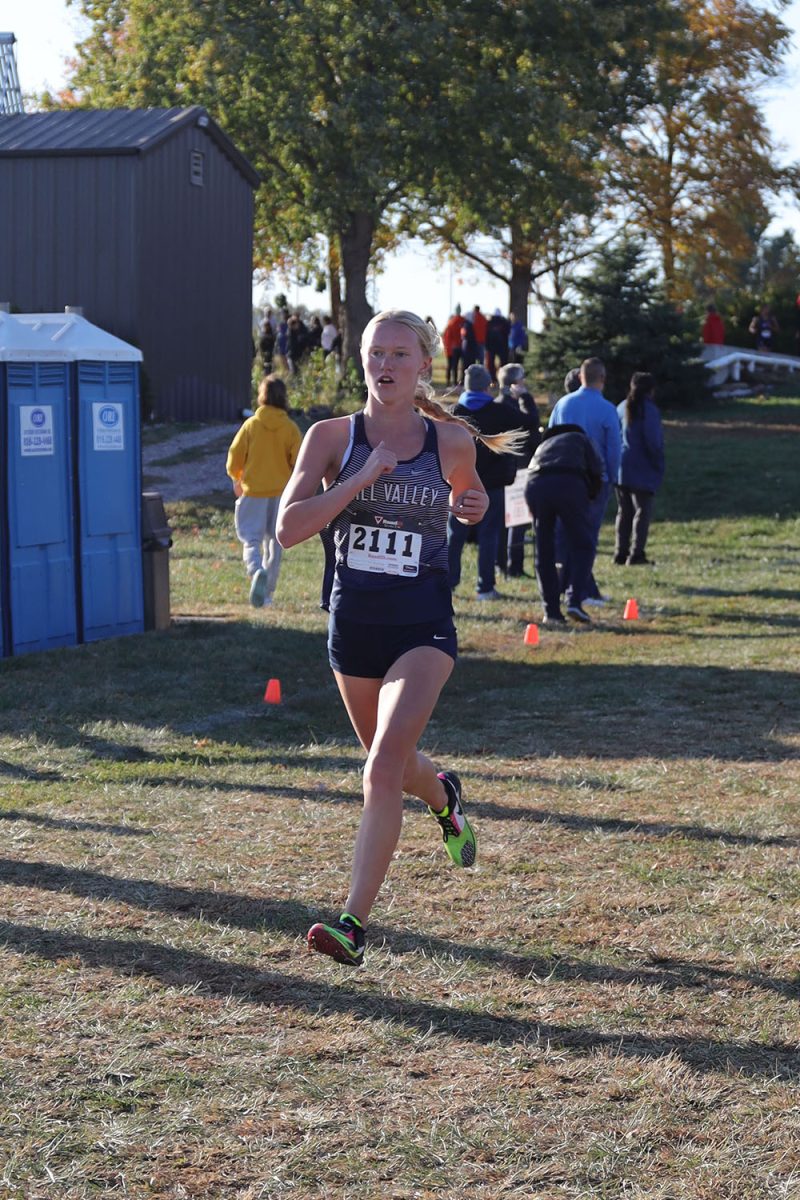 Striding out, senior Charlotte Caldwell looks at the course ahead of her.