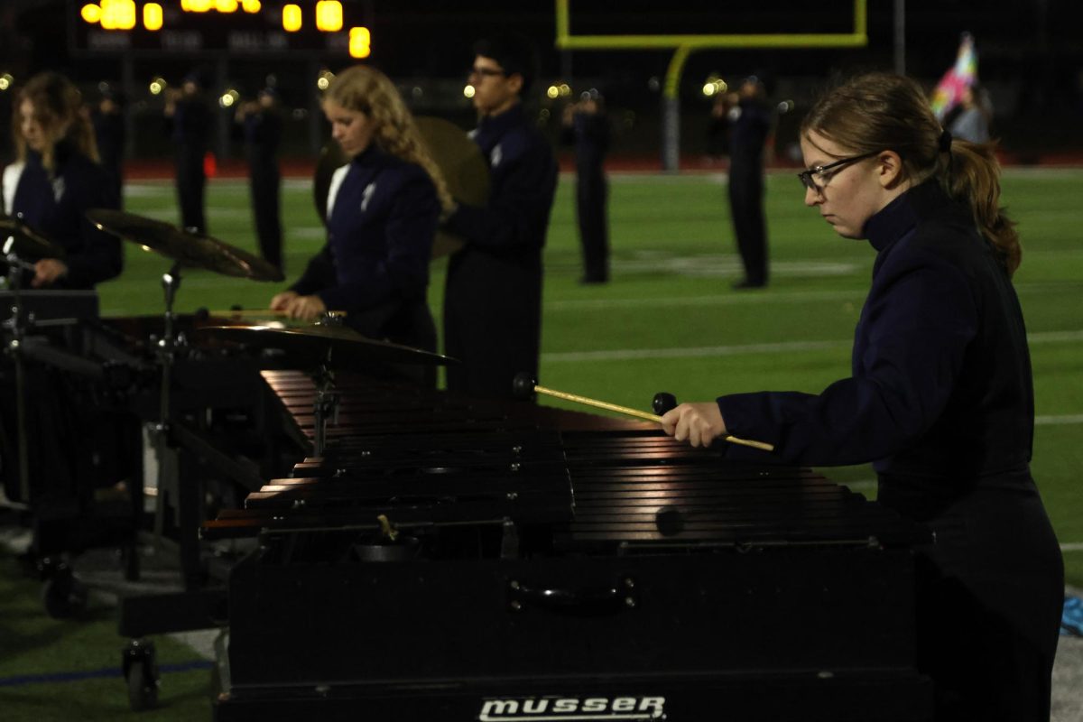 Mallets in hand, senior Lilly Rugenstein concentrates on hitting the right notes.
