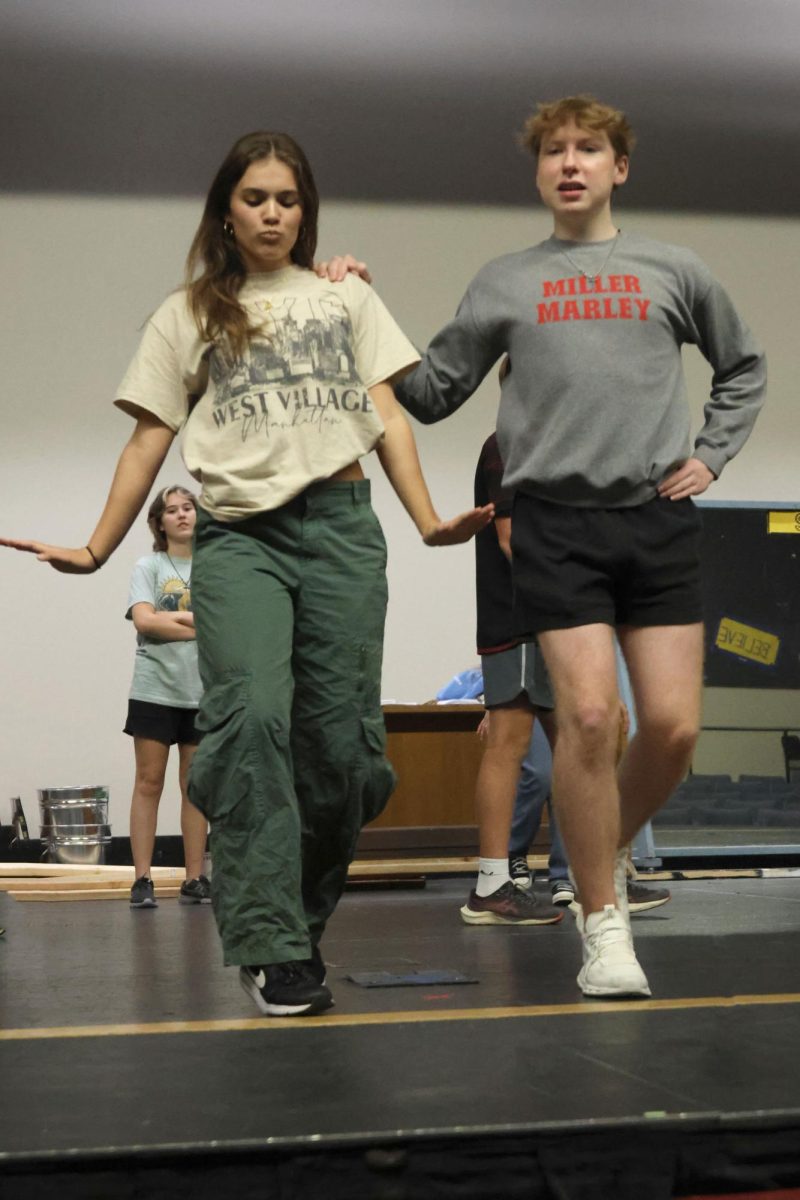 Dancing as a pair, seniors Logan Koester and Josie Mason rehearse their partner dance for the upcoming Repertory Theater musical.