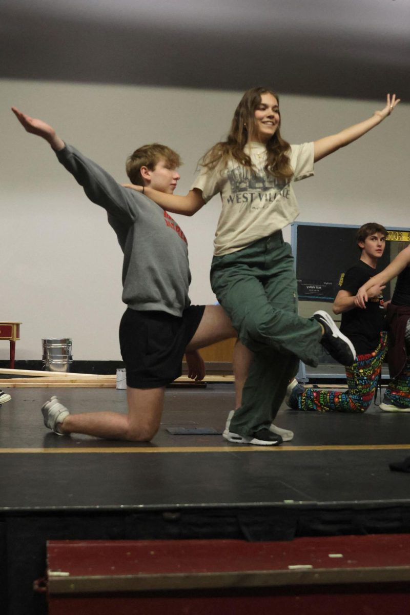 Preparing for their roles, seniors Logan Koester and Josie Mason perform the “Easter Parade” dance for their upcoming show.