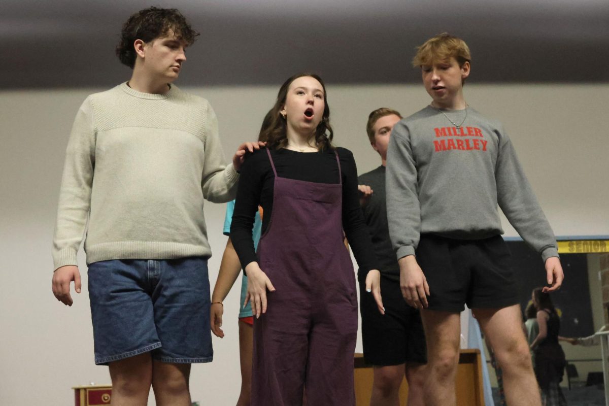 Seniors Blake Gray, Reese Miller, and Logan Koester practice their trio dance for the opening number in the fall Repertory Theater show.