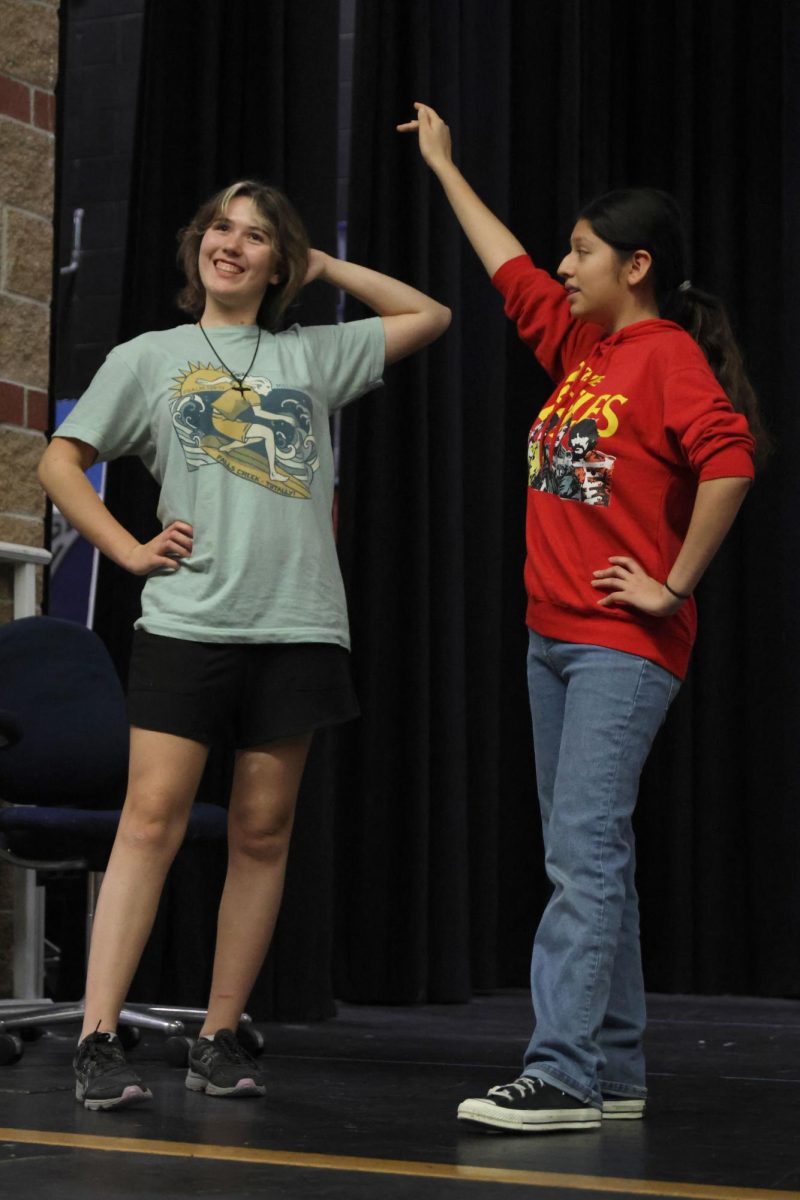 Practicing their opening dance for the Repertory Theater show, junior Katie Shinkle and sophomore Natalia Castillo-Ramirez enthusiastically show off their moves.