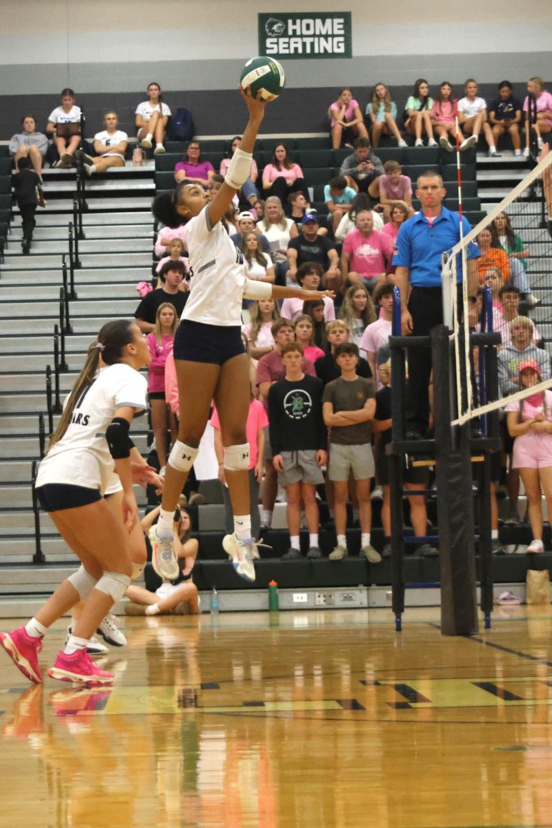 With her eyes focused on the ball, junior Leilah Perry looks to tap the ball over the net.
