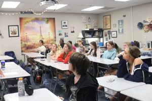 Students sit and listen to French Club sponsor Denise Smith in their first French Club meeting Oct. 9.