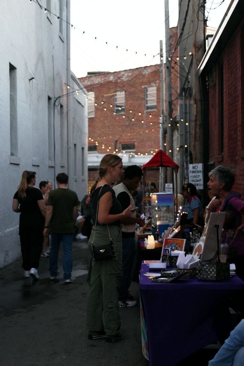 People and art vendors flood the alleyways of the Crossroads district on Friday, Oct. 1